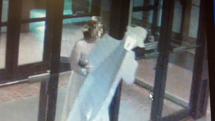 Caught in the act--here's The Bogie's illegal escort out of the Civic Center . . . 