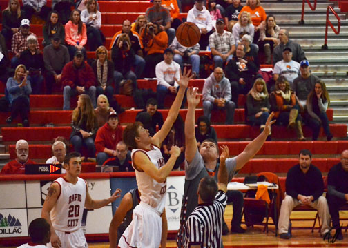 Tanner takes the opening tipoff against Natrona. Photo by Taber Oman.